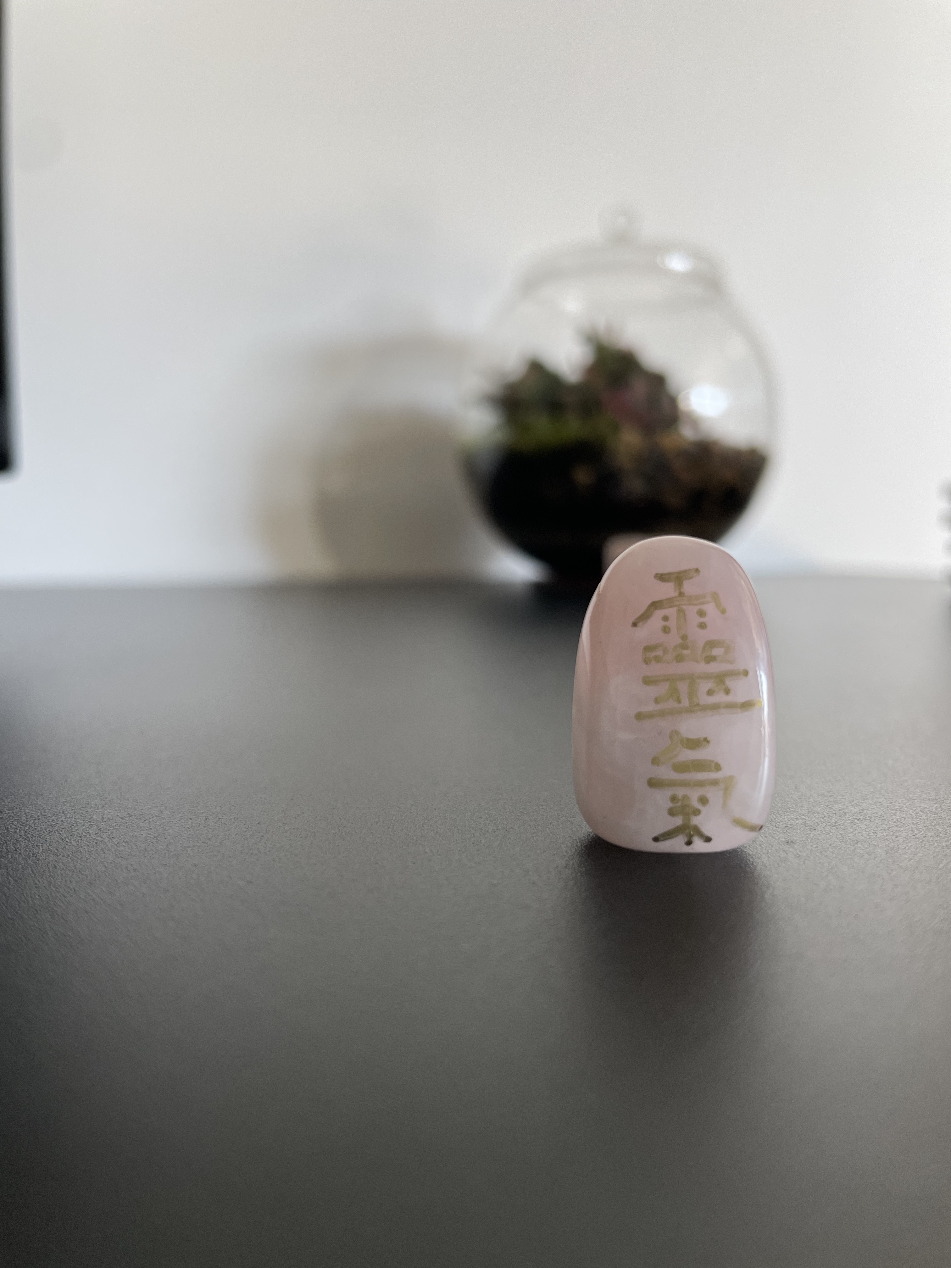 Rose quartz tumble stone with Reiki kanji in gold