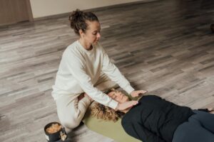 Hands-off Reiki healing during a group Reiki session in Beaconsfield WA, highlighting relaxation, nervous system support, and community connection